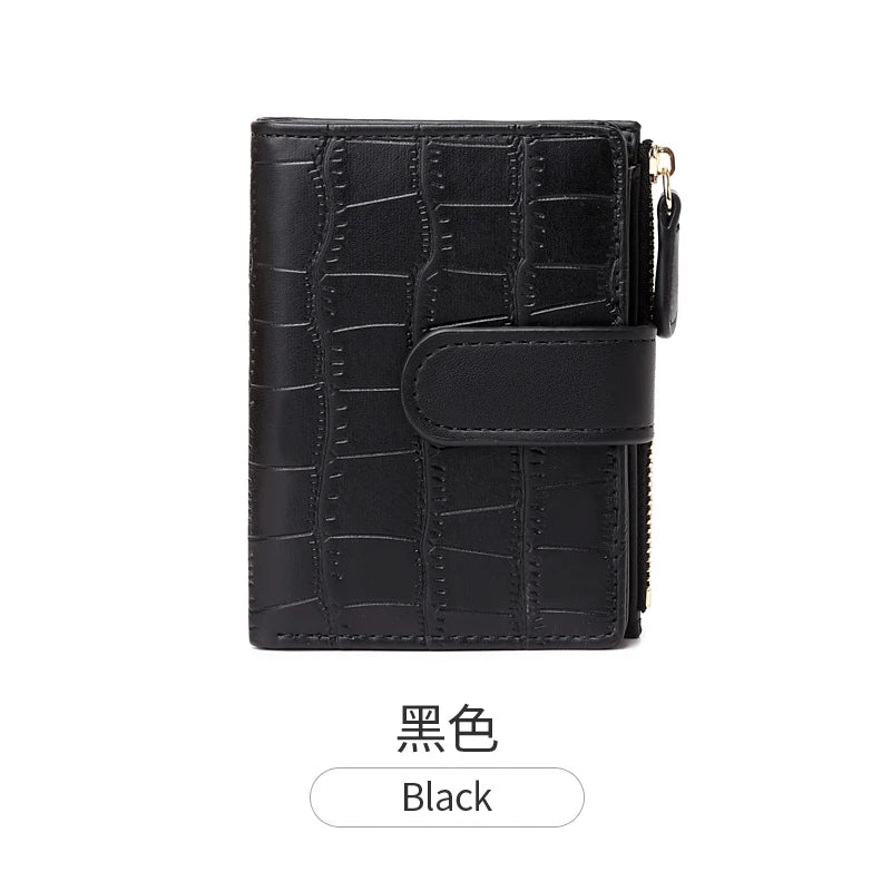 Black women's minimalist croc-embossed PU leather bi-fold wallet.