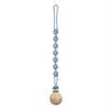 A silicone pacifier clip with a teether, featuring a long chain of round beads and a wooden ball.