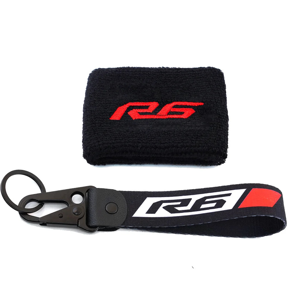 Black fabric cover sock with red R6 logo and a black strap for a brake fluid reservoir.