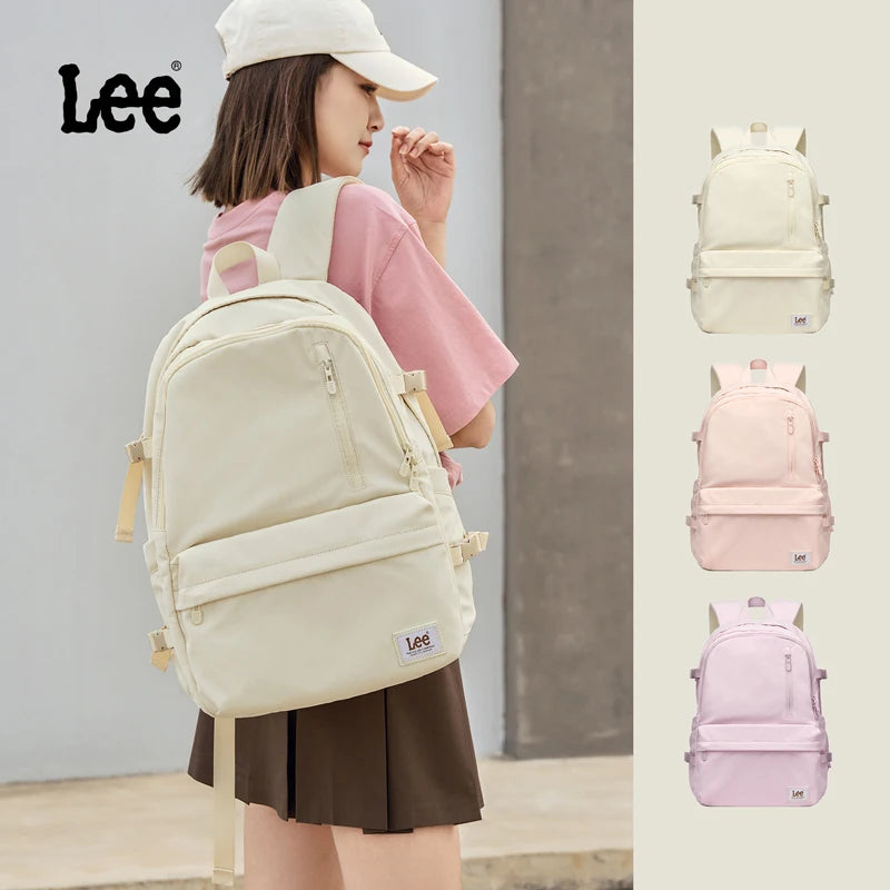 A young woman is wearing a cream-colored Lee laptop backpack, shown alongside pink and purple variations.
