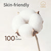 Close-up of white cotton balls used as a skin-friendly feeding accessory or bib.