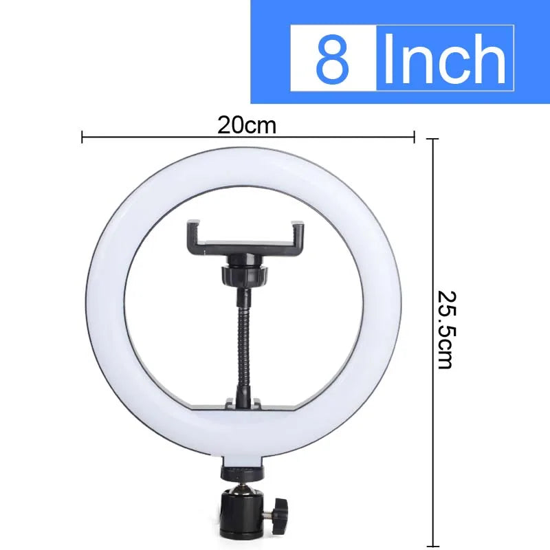 A white adjustable ring light with a circular frame and a tripod mount is shown.