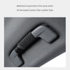 A close-up view of a gray 3D simulated carbon fiber leather style grab handle protector cover.