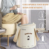 A woman is using a collapsible foot bath basin for soaking, featuring a rose spa design and portable features.