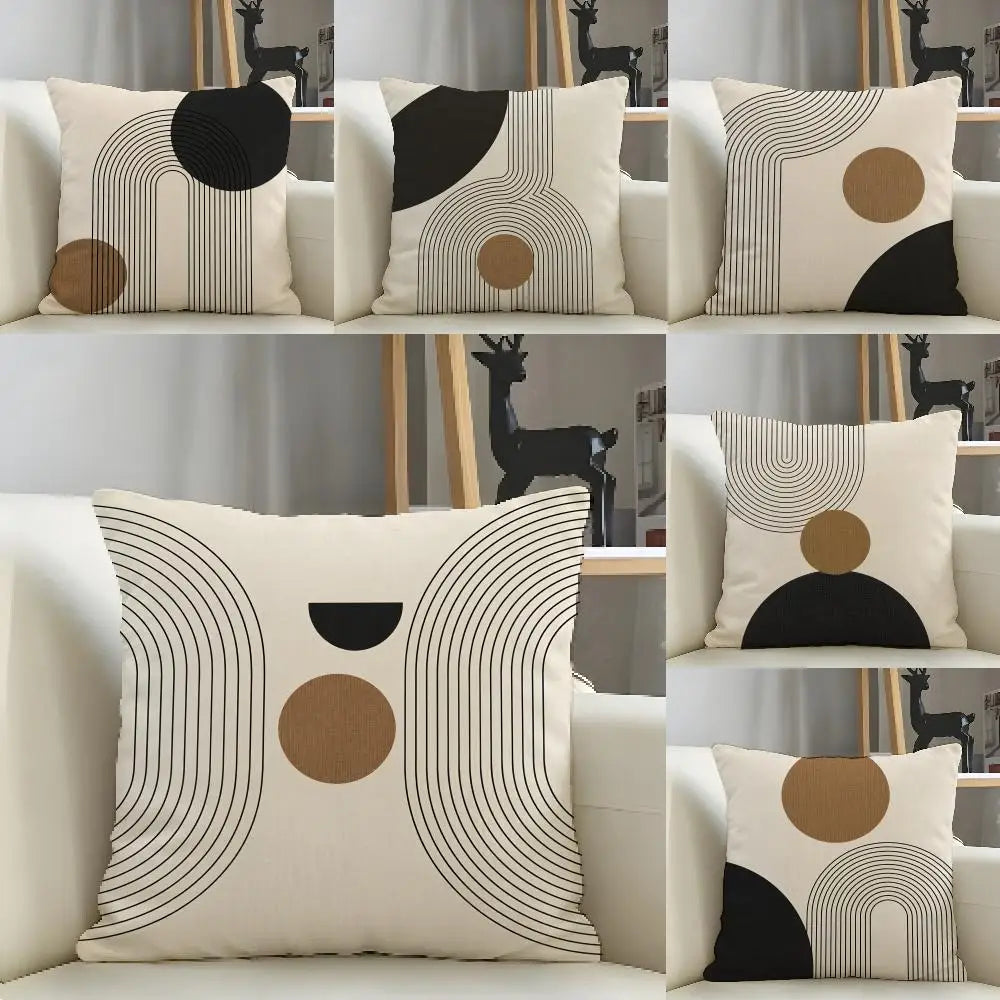 A collection of minimalist geometric linen cushion covers in black, beige, and white tones.