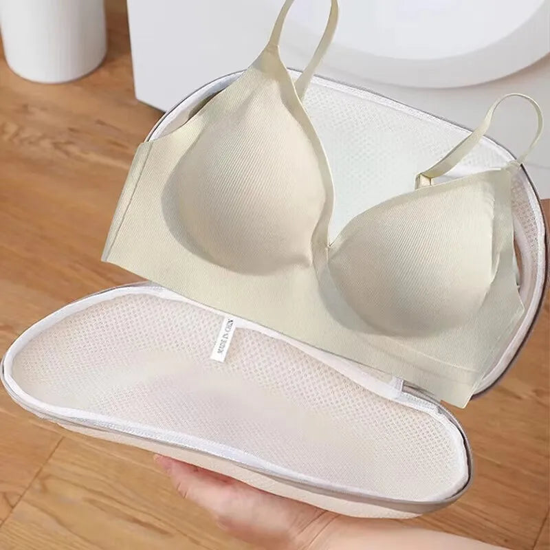 A beige bra is shown inside a white laundry bag with anti-deformation protection.