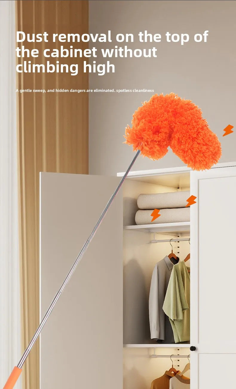 An extendable microfiber duster with an orange fluff head is shown removing dust from the top of a cabinet shelf.