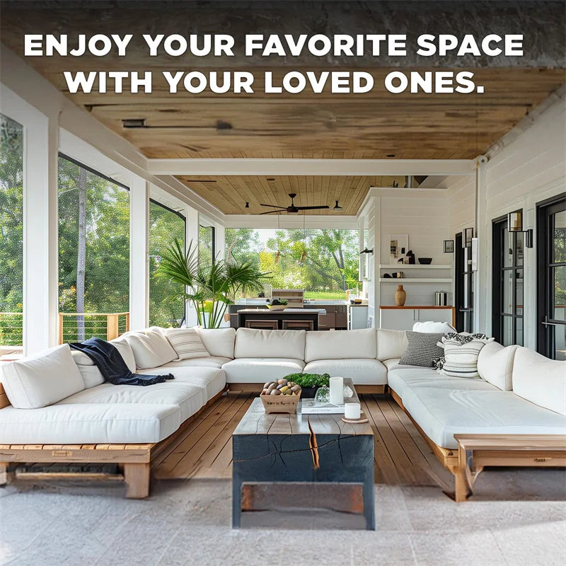 A bright, modern living room with large windows and a white sectional sofa, featuring a wooden floor and a rustic ceiling.