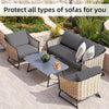 A set of grey stretch patio sofa covers for outdoor seating arranged on a paved patio.