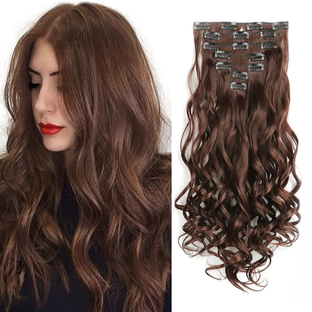 A woman shows off long brown wavy hair with clip-in extensions.