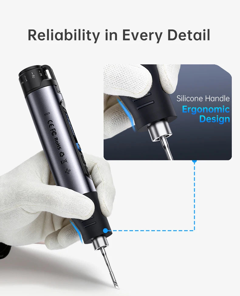 A hand holds a black cordless soldering iron with a silicone handle, demonstrating its ergonomic design.