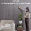 A woman is applying an SXP-KC 3D self-adhesive foam wall panel onto a gray textured wall.