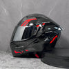 A black and red DOT-approved modular flip-up motorcycle helmet is shown against a gray background.