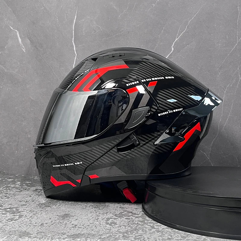 A black and red DOT-approved modular flip-up motorcycle helmet is shown against a gray background.