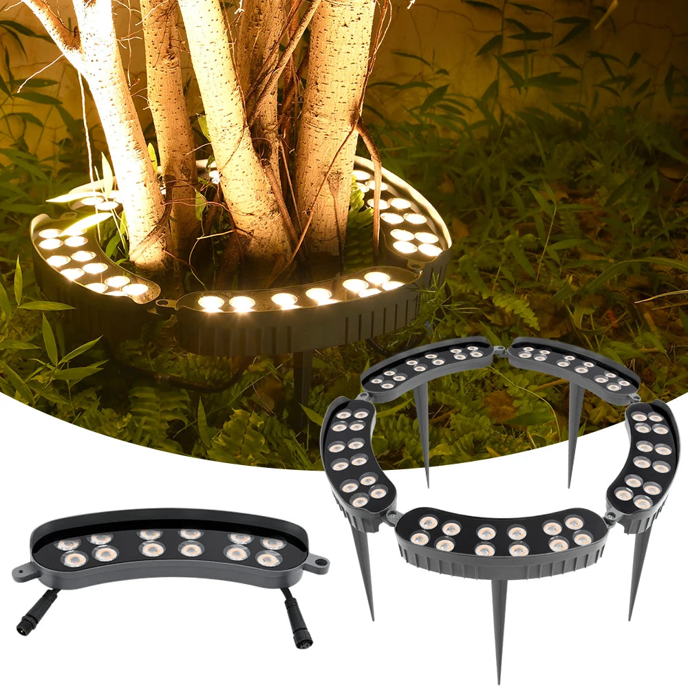 A tree-hugging LED garden light with a ground spike illuminating a natural outdoor setting.
