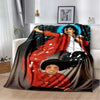A dark fabric throw blanket featuring a vibrant illustration of Michael Jackson in a red jacket and a smiling face.