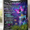 A dark blanket featuring Spanish text about love and hugs, with a purple butterfly design.