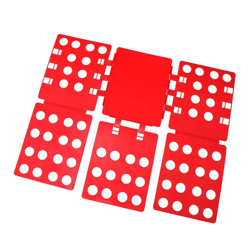 A red magic clothes folding board with multiple circular holes for organizing t-shirts.