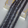 Black crystal beaded string curtain for doorways and windows displayed next to a box