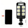 Black solar wall light with motion sensor and remote control, featuring multiple LED floodlights.