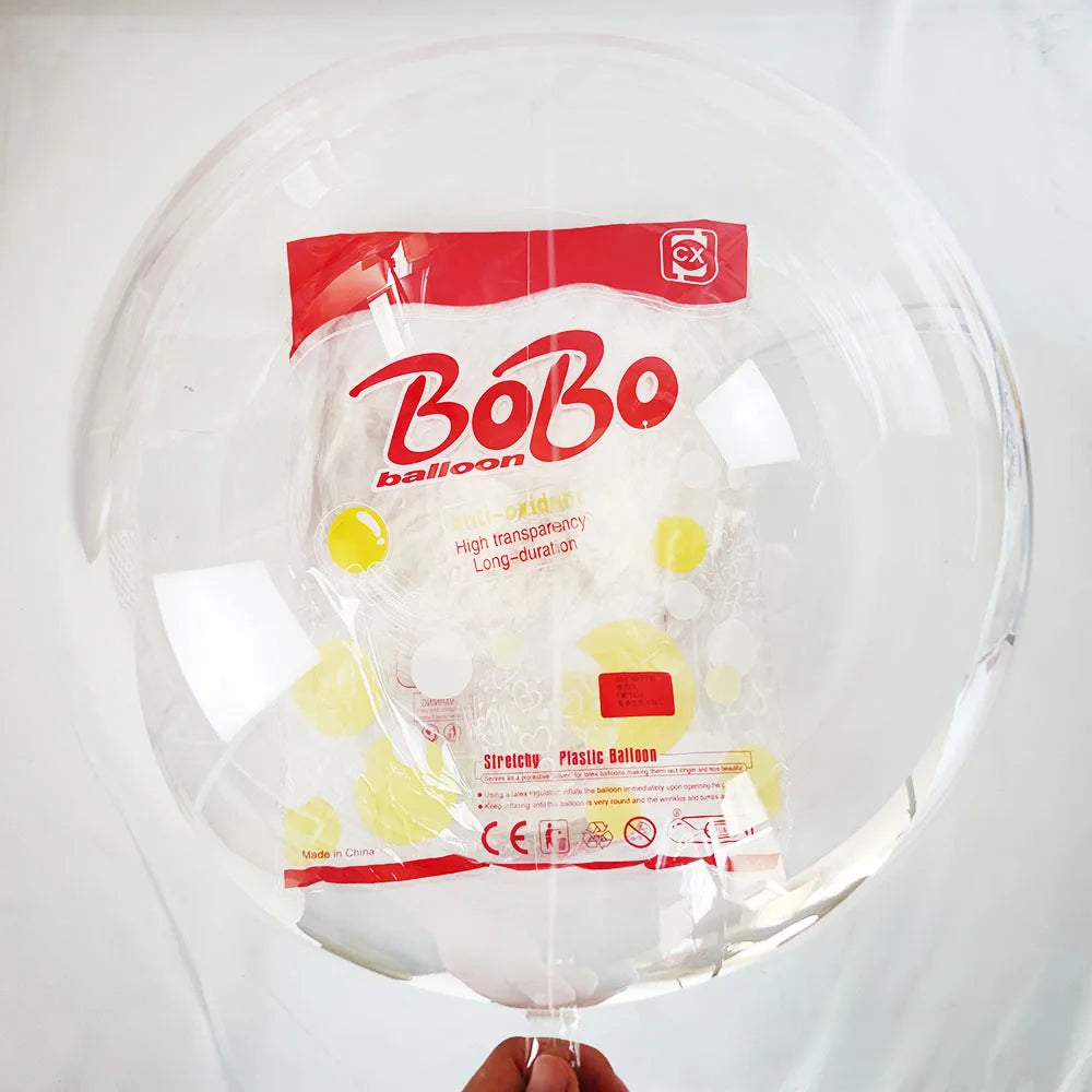 A clear balloon filled with white confetti and a red label featuring the BoBo brand.