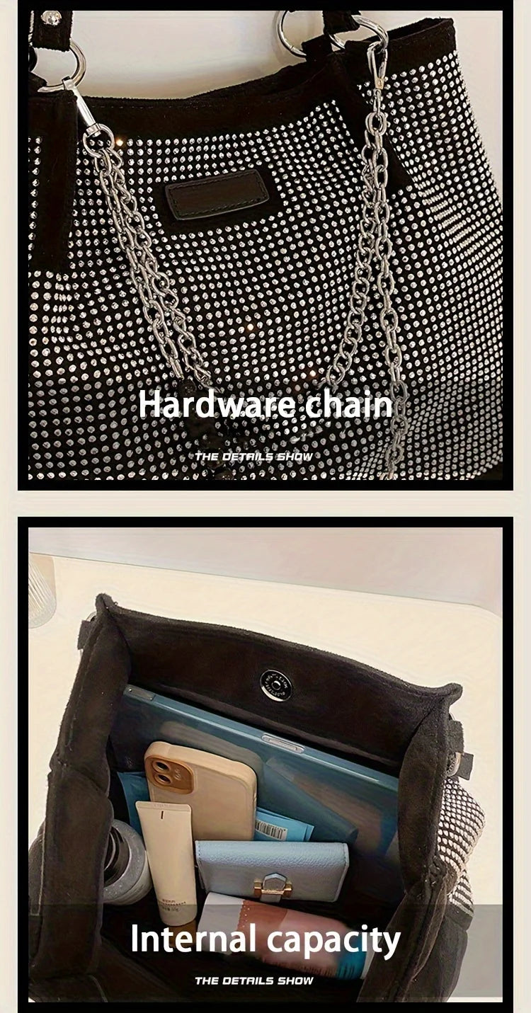 A close-up of a black shoulder bag showing the hardware chain and internal capacity.