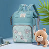 A light blue bear print waterproof diaper backpack is shown against a blue background with a green leaf.