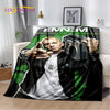 A throw blanket featuring a graphic of Eminem and 2Pac with a dark background.