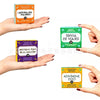 Hands holding various Spanish after-dinner party card games with titles like Adivina esa palabra and Trivia de Viajes
