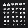 A collection of 100 acrylic pearl spacer beads in various sizes and shapes arranged on a dark surface.