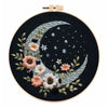 DIY embroidery kit featuring a silver crescent moon and golden butterfly design on black fabric