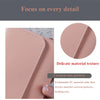 Close-up of a pink slim triple-fold PU leather wallet showing delicate texture and cartoon patterns.