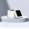 A stack of white replacement refill rings for smart kitchen trash cans displayed on a light gray surface.