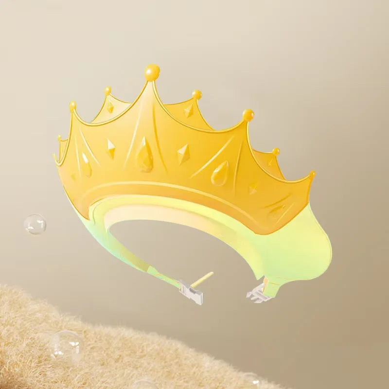 A yellow adjustable baby bath shampoo shield cap with ear protection is shown against a light background.