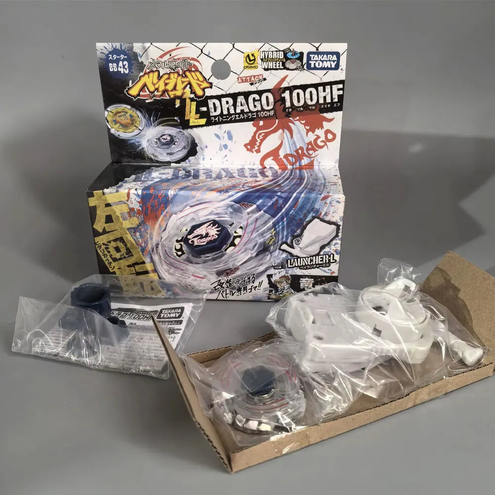 A box and components for the L-Drago 100HF spinning top battle set featuring a metal top and accessories.