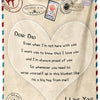 A cream-colored fleece throw blanket with a heart design and text expressing love to a dad.