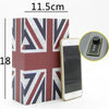 A rectangular hidden book safe featuring a Union Jack design, shown next to a smartphone and a combination lock.