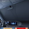 Interior view of a car showing the sunshade effect on the windshield and dashboard.