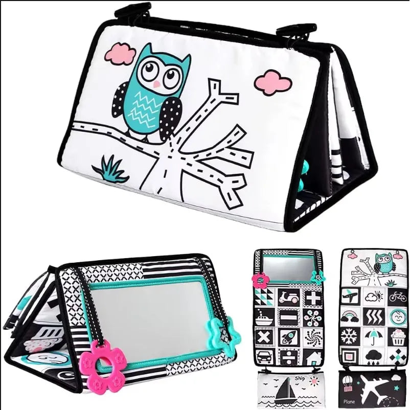 A high-contrast crinkle cloth book with a tummy time mirror featuring an owl design for babies.