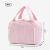 A pink soft-shell makeup bag with a wide opening shown from the side.