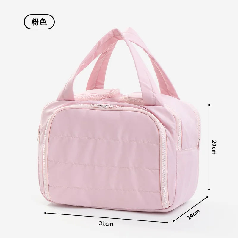 A pink soft-shell makeup bag with a wide opening shown from the side.