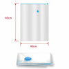 A white vacuum storage bag with a valve, shown next to its dimensions.