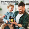 A father is showing a boy a black Infinity Cube fidget toy for concentration and focus.