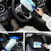 A hand is using a blue electrostatic dusting refill with a white fiber head on a car interior surface.