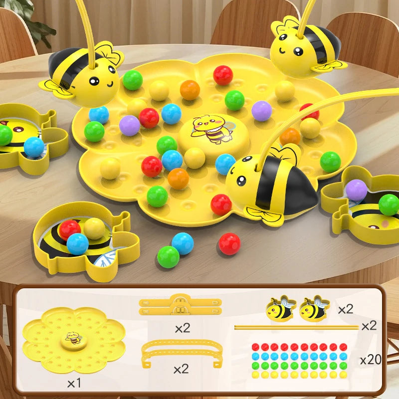 A yellow board game featuring bees and colorful balls is displayed on a wooden table.