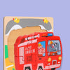 A wooden puzzle set depicting a red fire truck with cartoon animals and traffic shapes on a light wood background.