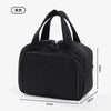 Black large travel makeup bag with a wide opening shown from the side.