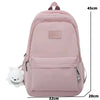A pink waterproof nylon laptop backpack with ergonomic straps shown from the back.