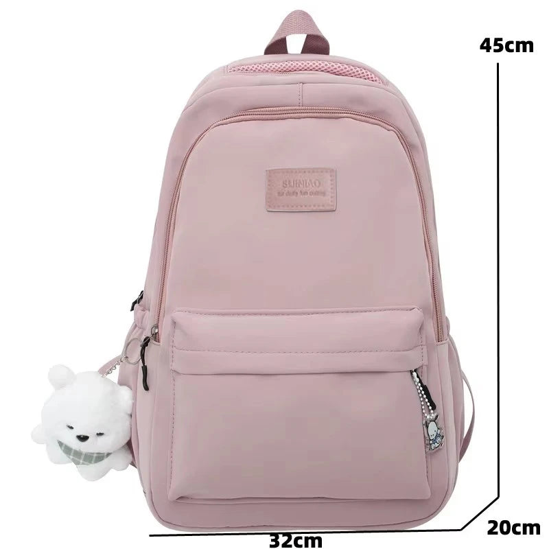 A pink waterproof nylon laptop backpack with ergonomic straps shown from the back.
