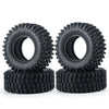 A pair of black rubber mud terrain tires for Axial SCX24 and TRX4M, stacked on top of each other.